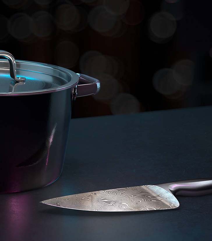 Ein WMF Kochtopf und ein WMF Messer in Szene gesetzt auf einem dunklen Tisch